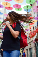 A young woman walks in chinatown 