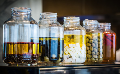 Glassware with canned food and cooking ingredients.