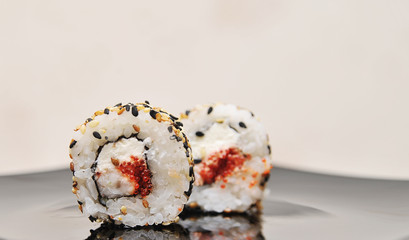 Japanese rolls on stone background.