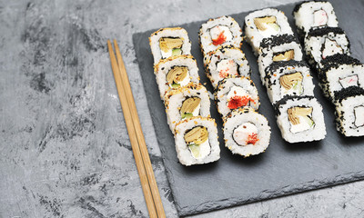 Japanese rolls on stone background.