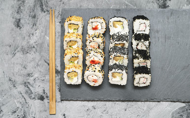 Japanese rolls on stone background.