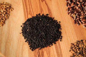 top view closeup wooden board with assorted groat handfuls