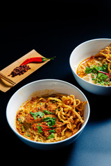 Khao Soi Chicken, a Thai food that is widely popular in the north along with the side dishes.