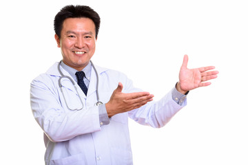 Studio shot of Japanese man isolated against white background