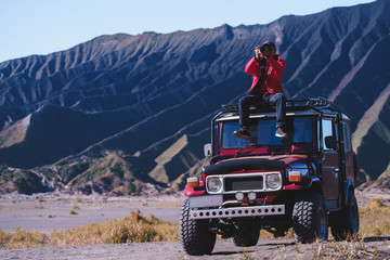 Male tourists stay 4x4 Car service for sight seeing around Bromo mountain tour