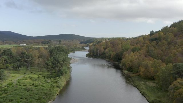 Aerial view of the River Dee near the Scottish town of Ballater in the Cairngorms National Park, Aberdeenshire. Low elevating view from above the river.