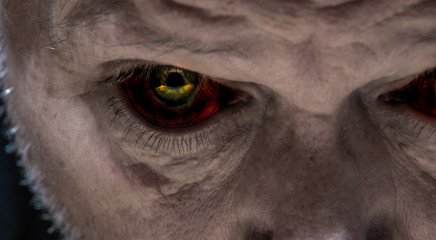 Close-up of the creepy eyes of an elderly man. Concept: Halloween