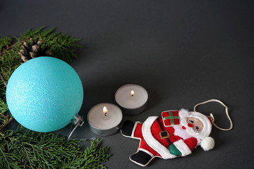 Christmas decorations, candles on a gray background