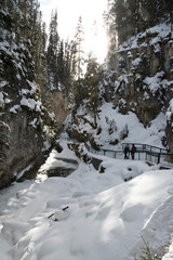 Fototapeta na wymiar Hiking to Johnston canyon's frozen waterfalls in winter