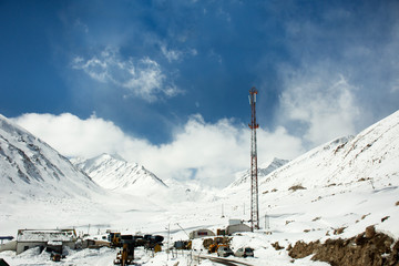 Indian and traveler people stop car rest at check point base camp on Khardung La Road in Himalaya mountain at Leh Ladakh in Jammu and Kashmir, India