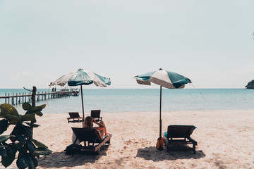 The chair on the beach on a bright day and blue sky background.