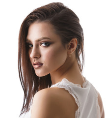 Fototapeta premium Sexy brunette in white lace top studio portrait