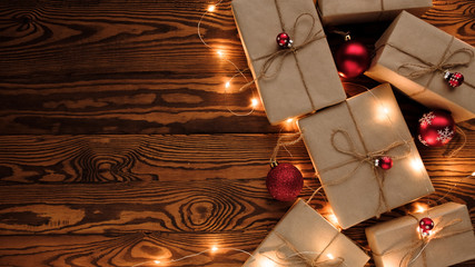 Christmas presents laid on a wooden table background. New Year and Christmas concept. New 2020 year. flat lay, top view, copy space