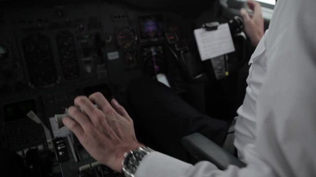 Close up scene from Airliner cockpit - trottle stick hand pilot hands