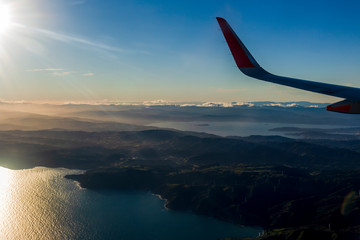 Naklejka na ściany i meble Aerial View from an Airplane Window flying over wellington, New Zealand