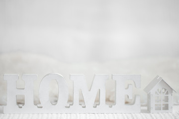 Background with Wooden inscription home. Decorative letters forming word HOME.