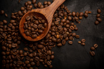 Coffee beans on black background top view 