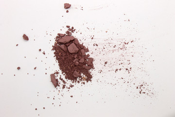 This is a photograph of a Matte Light Mahogany Powder Eyeshadow isolated on a White Background