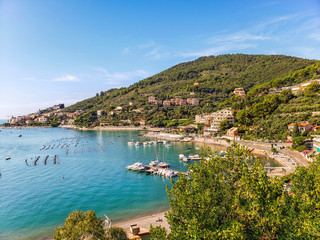 Fototapeta na wymiar Beautiful Ligurian coast of Italy. View of a part of the bay of poets near the small town of Portovenere and the island of Palmaria.
