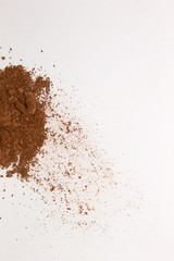 This is a photograph of a Matte Brown Powder Eyeshadow isolated on a White Background