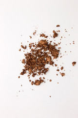 This is a photograph of a Metallic Bronze Powder Eyeshadow isolated on a White Background
