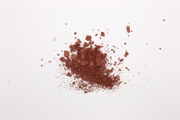 This is a photograph of a Burnt Umber Powder Eyeshadow isolated on a White Background