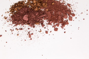 This is a photograph of a Burgundy,Metallic Bronze,and Burnt Umber Powder Eyeshadow isolated on a White Background