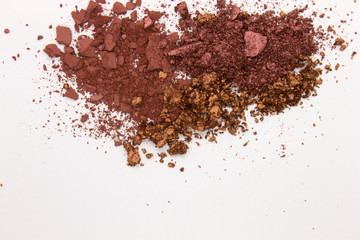 This is a photograph of a Burgundy,Metallic Bronze,and Burnt Umber Powder Eyeshadow isolated on a White Background