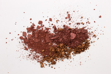 This is a photograph of a Burgundy,Metallic Bronze,and Burnt Umber Powder Eyeshadow isolated on a White Background