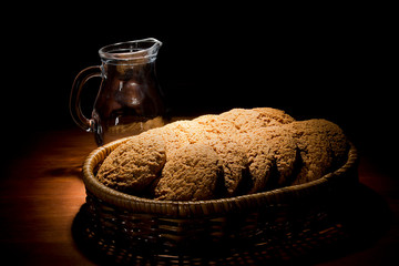Cookies in a basket and a jug