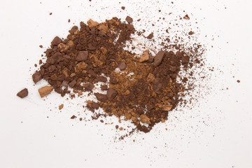 This is a photograph of Brown Powder Eyeshadow isolated on a White Background