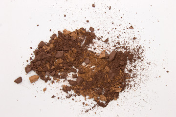 This is a photograph of Brown Powder Eyeshadow isolated on a White Background