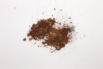 This is a photograph of Brown Powder Eyeshadow isolated on a White Background