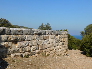 Fototapeta na wymiar An ancient wall in the ancient city of Rhamnous, in Attica, Greece