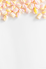 Candies. Marshmallows frame on white background top view space for text