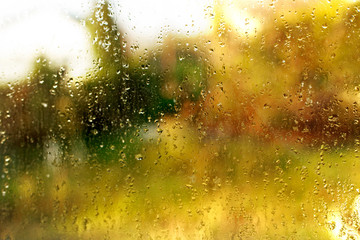 Orange tectured glass surface. Structure of water drop tracks on glazing plastic (pvc) window....