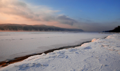 ice lake, shore, dawn in a frosty morning