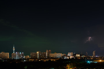 Fototapeta na wymiar Night city, thunderstorm, lightning. Pattaya
