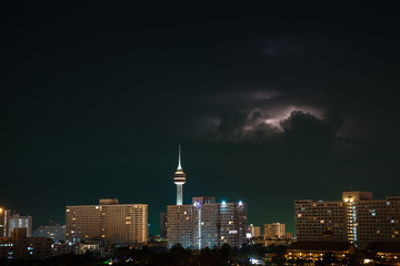 Fototapeta premium Night city, thunderstorm, lightning. Pattaya