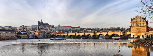 Charles Bridge in Prague, spring panorama on a sunny day, Czech Republic