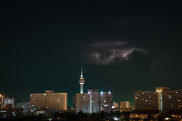 Fototapeta premium Night city, thunderstorm, lightning. Pattaya