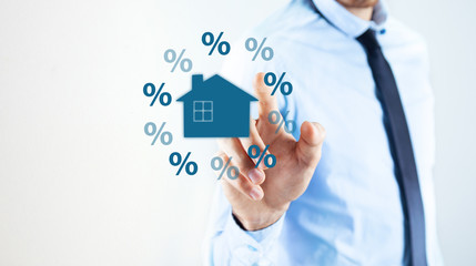 businessman and percent icon with home