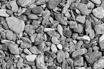 Black small road stone background, dark gravel pebbles stone texture, granite,marble