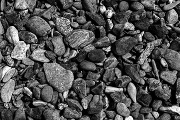 Black small road stone background, dark gravel pebbles stone texture, granite,marble