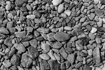 Black small road stone background, dark gravel pebbles stone texture, granite,marble