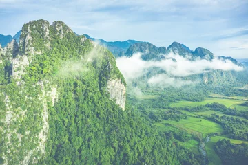 Foto op Canvas Aerial view of beautiful landscapes at Vang Vieng , Laos. Southeast Asia. Photo made by drone from above. Bird eye view. © Curioso.Photography
