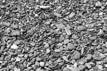 Black small road stone background, dark gravel pebbles stone texture, granite,marble