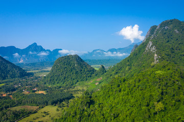 Naklejka na ściany i meble Aerial view of beautiful landscapes at Vang Vieng , Laos. Southeast Asia. Photo made by drone from above. Bird eye view.