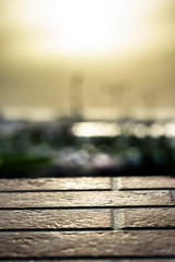 closeup of a marble table and sunrise in the background and blurry city background 