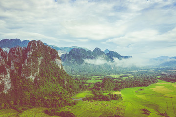 Fototapeta premium Aerial view of beautiful landscapes at Vang Vieng , Laos. Southeast Asia. Photo made by drone from above. Bird eye view.